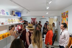 Laura Currie from Prospect NY giving a tour of the Through the Flower Art Space Gift Shop, Belen, NM 2019